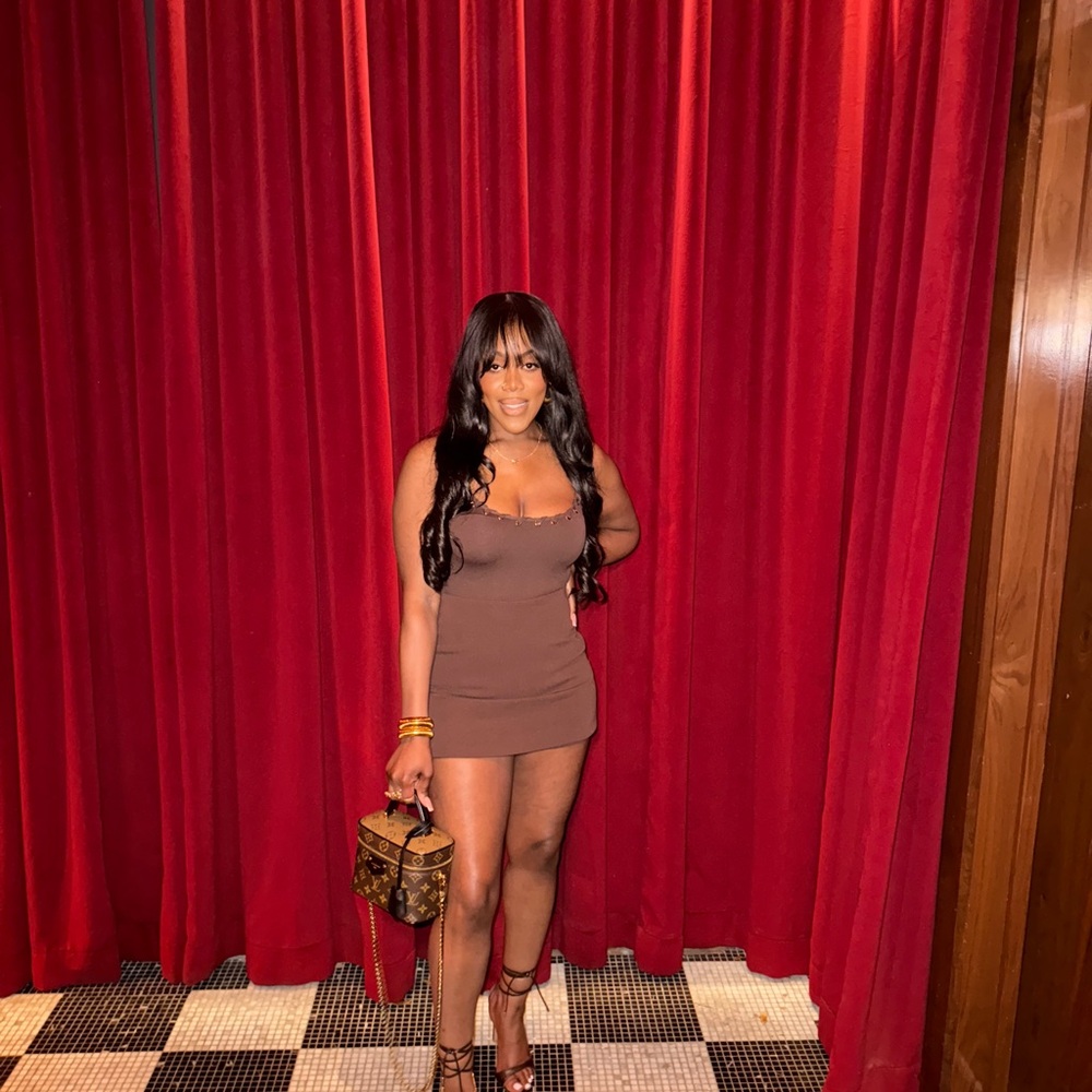Elegant Brown Mini skort brown body suit w/ gold detailing.